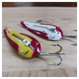Two-piece lot of fish trap, weedless, snagless, spoon lures.