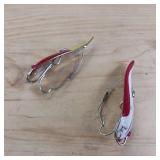 Two-piece lot of fish trap, weedless, snagless, spoon lures.