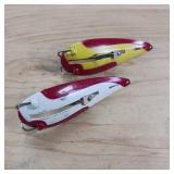 Two-piece lot of fish trap, weedless, snagless, spoon lures.