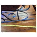 Vintage wicker and wrought iron decorative sleigh, often used as Christmas or holiday home decor