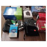 Large Lot  collection of electronic networking and media hardware, including several Slingbox devices, a digital-to-analog converter box, and various routers/modems