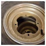 Set of used ATV tires mounted on gold-colored rims