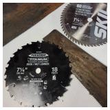 A collection of cutting tools, primarily circular saw blades for power saws and traditional hand saws.