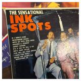 Large collection of vintage music vinyl records featuring artists like Laura Branigan and The Ink Spots