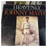 A collection of vintage vinyl records from various artists and genres.