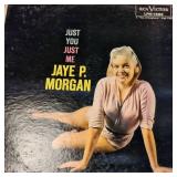 A  large collection of vintage vinyl records from artists like Johnny Mathis, Billy Vaughn, Ray Conniff, and Dean Martin