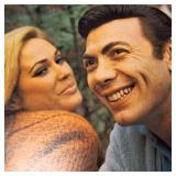 A  large collection of vintage vinyl records from artists like Johnny Mathis, Billy Vaughn, Ray Conniff, and Dean Martin