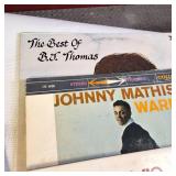 A  large collection of vintage vinyl records from artists like Johnny Mathis, Billy Vaughn, Ray Conniff, and Dean Martin