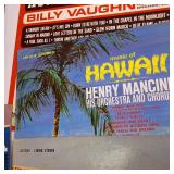 A  large collection of vintage vinyl records from artists like Johnny Mathis, Billy Vaughn, Ray Conniff, and Dean Martin