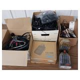 Large collection of various electronic cables, connectors, and a boxed electronic devices