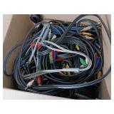 Large collection of various electronic cables, connectors, and a boxed electronic devices