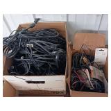 Large collection of various electronic cables, connectors, and a boxed electronic devices