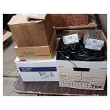 Large collection of various electronic cables, connectors, and a boxed electronic devices