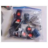 Collection of vintage video game accessories and plug-and-play consoles including PlayStation 2 and PlayStation 1 controllers