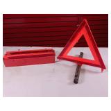 Emergency warning triangle kit used to alert other drivers to a roadside hazard or disabled vehicle.