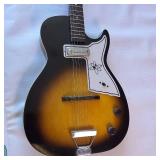 Vintage 1960s Harmony Stratotone electric guitar - highly collectible instrument.