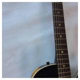 Vintage 1960s Harmony Stratotone electric guitar - highly collectible instrument.