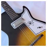Vintage 1960s Harmony Stratotone electric guitar - highly collectible instrument.