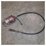 Hand-held electric concrete vibrator used to remove air bubbles and solidify concrete mixtures