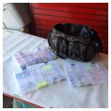 Fishing tackle bag set Okeechobee Fats soft-sided tackle bag paired with clear plastic utility trays chock full of various fishing lures.