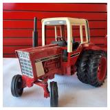 Vintage Ertl 1/16 scale International Harvester 1586 farm tractor toy plus two vintage tin hay wagons