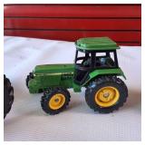 Collection of vintage John Deere harvesting equipment models, 1:64 scale set
