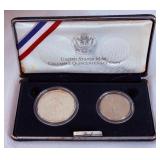 1992 Columbus Quincentenary 2 coin proof set - case is fire damaged, no COA but coins appear to be in good shape