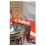 Coca Cola Dishes , and unopened tin with railroad toy on top