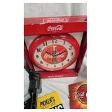 Coke Clock, Goblet, Tin, and Books