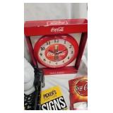 Coke Clock, Goblet, Tin, and Books