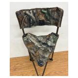 Mobile hunting blind trifold chair.