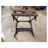 Adjustable folding work bench