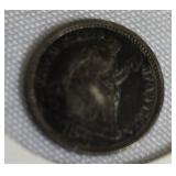 1873 Seated Liberty Half Dime  Type 4, featuring a legend on the obverse side.