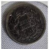 1873 Seated Liberty Half Dime  Type 4, featuring a legend on the obverse side.