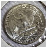 Two Washington quarters from 1964-D and 1965.