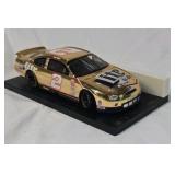 Rusty Wallace Miller Lite Ford Taurus – Gold Chrome Diecast on Black Base