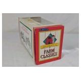 Diecast John Deere Model A tractor features a green body with yellow spoked wheels and detailed engine components. Packaged in the original window box labeled Farm Classics by ERTL. Classic farm toy r