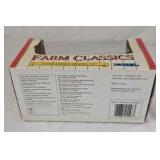 Diecast John Deere Model A tractor features a green body with yellow spoked wheels and detailed engine components. Packaged in the original window box labeled Farm Classics by ERTL. Classic farm toy r