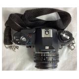 Nikon EM SLR 35mm Camera with 50mm Nikon Series E Lens and Flash