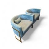 2 barrel design with teal velvet upholstery and gold legs.