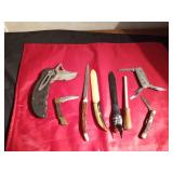 4 knives, 3 letter openers, and a knife sharpener