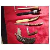 4 knives, 3 letter openers, and a knife sharpener