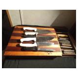 Vintage cutting board with a pull-out drawer of vintage Chicago Cutlery knives and more