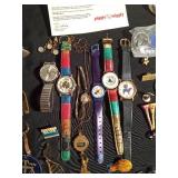 Vintage watches, advertisement key chains, cuff links, pins vintage souvenir folding cup, noise maker toy and more