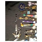 Vintage watches, advertisement key chains, cuff links, pins vintage souvenir folding cup, noise maker toy and more