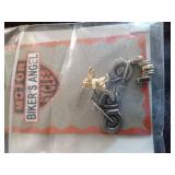 Harley Davidson items: Ring, lamp, tool bucket belt, stationary set in tin, helmet bag headbands and a motorcycle angel pin