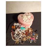 Heart shaped with rose on top full of jewelry