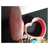 Heart shaped with rose on top full of jewelry