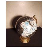 Black, white and blue globe with metal stand