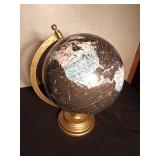 Black, white and blue globe with metal stand